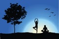 Two yoga girls on hill near tree