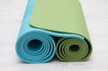 Two yoga iyengar mats green and blue colors