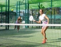 Two women tennis players playing padel Royalty Free Stock Photo