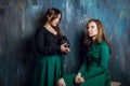 Two young adult female making photos with old vintage film camera, selective focus Royalty Free Stock Photo