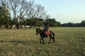 Two young adults are ride on their Horse, in city ground.