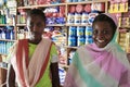 Two young African girl salesgirl in a shop household chemicals. Royalty Free Stock Photo