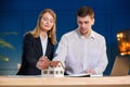 Two young architects during work day in the office. Royalty Free Stock Photo