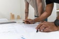 Two young architects working in their studio on a project Royalty Free Stock Photo