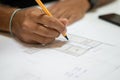 Two young architects working in their studio on a project Royalty Free Stock Photo