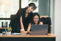 Two young asia business woman working together in office space Royalty Free Stock Photo