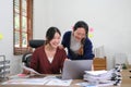 Two young asia business woman working together in office space Royalty Free Stock Photo