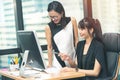 Two young asia business woman working together in office space Royalty Free Stock Photo