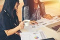 Two young asia business woman working together in office space Royalty Free Stock Photo