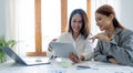 Two young asia business woman working together in office space Royalty Free Stock Photo