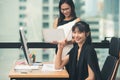 Two young asia business woman working together in office space Royalty Free Stock Photo