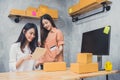 Two young Asian people startup small business entrepreneur SME d Royalty Free Stock Photo