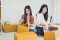 Two young Asian people startup small business entrepreneur SME d Royalty Free Stock Photo