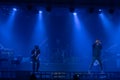 Two young Asian pop rock singers and band are performing with full spectrum of light and sound at the concert Royalty Free Stock Photo