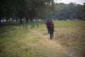 Two young Indian sisters walking in a field in winter afternoon. Royalty Free Stock Photo