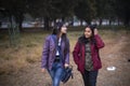 Two young Indian sisters walking in a field in winter afternoon. Royalty Free Stock Photo