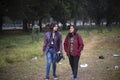 Two young Indian sisters walking in a field in winter afternoon. Royalty Free Stock Photo