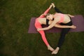 Two young attractive girls practicing yoga outdoor. Royalty Free Stock Photo