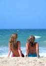 Two young attractive women chilling in the sun on holiday or vac