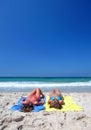 Two young attractive women chilling in the sun on holiday or vac