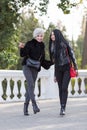 Two young attractive women in a public Park