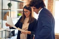 Two young beautiful business workers smiling happy and confident Royalty Free Stock Photo