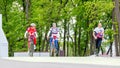 two young beautiful cyclists for a walk in the park Royalty Free Stock Photo