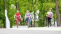 two young beautiful cyclists for a walk in the park Royalty Free Stock Photo