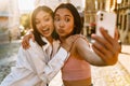 Two young beautiful funny happy asian girls taking selfie Royalty Free Stock Photo