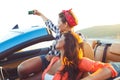 Two young beautiful girls are doing selfie in a convertible Royalty Free Stock Photo