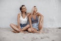 Two young beautiful happy summer girls on the beach Royalty Free Stock Photo