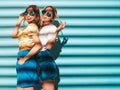 Two young beautiful hipster girls in trendy clothes in studio Royalty Free Stock Photo