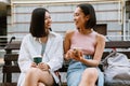 Two young beautiful smiling asian girls looking at each other Royalty Free Stock Photo