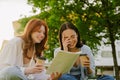 Two young beautiful smiling happy girls with closed eyes Royalty Free Stock Photo