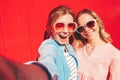 Two young beautiful smiling hipster female Royalty Free Stock Photo