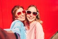 Two young beautiful smiling hipster female Royalty Free Stock Photo