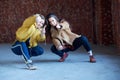 Two young beautiful smiling hipster girls in trendy clothes posing together. young carefree friends Royalty Free Stock Photo