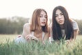 Two young women lie on the iawn Royalty Free Stock Photo