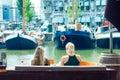 Two young blonde women drinking a cold beverage, the Rotterdam h