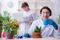 The the two young botanist working in the lab