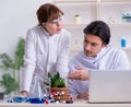 Two young botanist working in the lab