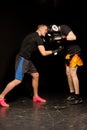 Two young boxers sparring in the ring