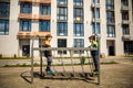 Two young boy active little child playing climbing at spring metal playground his hand to exercise at outdoor. Warm sunny day. Royalty Free Stock Photo