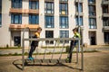 Two young boy active little child playing climbing at spring metal playground his hand to exercise at outdoor. Warm sunny day. Royalty Free Stock Photo