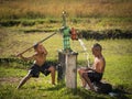 Two young boy rocking groundwater bathe in the hot days.