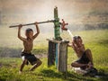 Two young boy rocking groundwater bathe in the hot days.