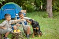 Two young boys with dogs on camping tirp with dogs Royalty Free Stock Photo