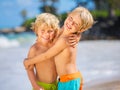 Two young boys having fun on tropcial beach Royalty Free Stock Photo