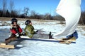 Two Young Boys On Ice Boat With Sails Royalty Free Stock Photo