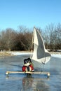 Two Young Boys On Ice Boat With Sails Royalty Free Stock Photo